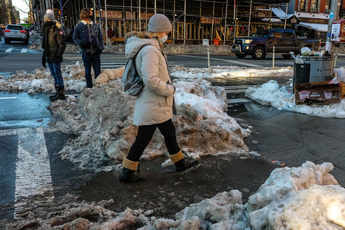 New Yorkers step over slush lagoons and frozen trash